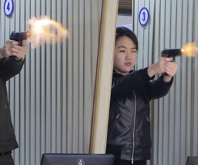 Kim Jong Un, daughter Ju Ae test pistols at munitions factory